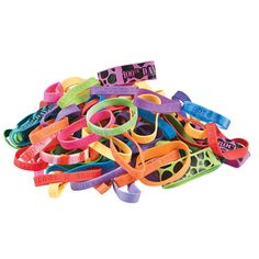 a pile of rubber bracelets on top of each other in different colors and sizes