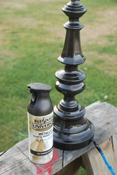 a bottle of rustoleum sitting on top of a wooden bench next to a lamp post