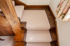 an overhead view of some stairs with carpet on the bottom and second handrails