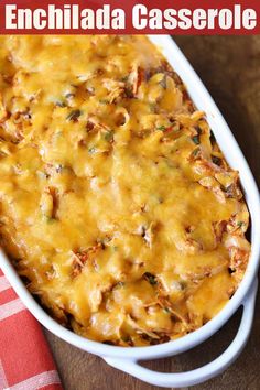 an enchilada casserole is shown in a white dish