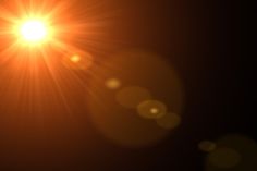 the sun shines brightly in the dark sky with bright lens flares on it