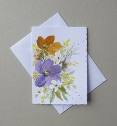 two greeting cards with flowers on them, one is purple and the other is yellow