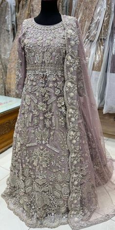 This is a made-to-order bridal reception gown with dupatta. MATERIAL DETAILS: Gown: embroidered net Dupatta: embroidered net Trouser: malai crepe Product details: Color can be customizable  Long long In beautiful lavender color with full Zardozi, Aari, Sequins work all on the front of the gown in silver color. heavy embroidered back boarder and work on the back trail of the gown Net heavy embroidered work on the sleeves Net heavy embroidered dupatta Dyed malai trouser NOTE: *NO additional fee wi Bridal Reception Gown, Gown Pakistani, Desi Bridesmaids, Walima Dresses, Pakistani Bridal Dress, Walima Dress, Nikkah Dress, Reception Gown, Latest Bridal Dresses