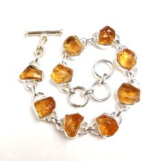 Raw Citrine Bracelet, Citrine Rough Bracelet, Handmade Jewelry, Yellow Color Bracelet, Art Deco Bracelet, Citrine 925 Solid Silver Bracelet Product:- Bracelet Modal no:- SKU-2094 Metal:- 925 Sterling Silver Gemstone :- Citrine Gemstone size:- 10 to 12 mm Approx Finishing:- Shiny polished We are using Pure 925 (Stamped) Sterling Silver with Natural Gemstone Jewelry, all of our jewelry designs are Handmade. We are adding new creative designs in our store regularly, for new handmade stuff please ge Citrine Birthstone, Solid Silver Bracelets, Bracelet Art, Popular Bracelets, Raw Citrine, Citrine Bracelet, Handmade Stuff, Color Bracelet, Citrine Jewelry