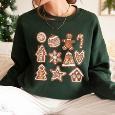 If you love Christmas cookies, this Cookie Baking Crew Gingerbread Cookie Crewneck Sweatshirt is perfect for you! Adult Unisex Sweatshirt Gildan 18000 *If you are interested in purchasing this shirt in a color that is not listed above, please contact me and I will see what I can do! I have added a color chart for you to reference, but please note that all colors may not be available. *If you really love this design but would like it on a different garment (sweatshirt, tank top, mug, bag, etc...) Cookie Sweater, Christmas Cookie Shirt, Cookie Baking Crew, Christmas Cookie Party, Cookie Shirt, Christmas Crewneck Sweatshirt, Cookie Christmas, Cookie Party, Gingerbread Cookie