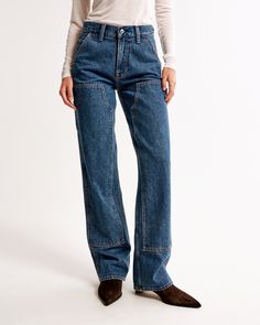 Our new classic mid rise slouchy jeans in a dark wash, with carpenter details and a clean hem. This fit features a 9.5” mid rise, is slouchy at the waist and hips, and eases through the thigh into a baggy, full-length leg shape. We recommend buying your true size for a slouchier fit. Size down for a closer fit. This jean is made from our heavyweight rigid denim, a super soft authentic cotton fabric with no stretch. Dark Wash Rigid Denim Cargo Jeans With Contrast Stitching, Dark Wash Cargo Jeans With Contrast Stitching, Cargo Jeans In Dark Wash With Contrast Stitching, Casual Bottoms With Contrast Stitching In Recycled Denim, Utility Denim Bottoms With Contrast Stitching, High Rise Utility Cargo Jeans With Contrast Stitching, Utility Workwear Jeans In Recycled Denim, Utility Style Recycled Denim Jeans For Work, Denim Blue Utility Jeans With Contrast Stitching