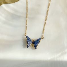 "This handmade, butterfly necklace symbolizes your rebirth and the next chapter in your story. It's time to start something new and trust the magic of new beginnings. Embrace the beauty of your own transformation and let go of the past. DETAILS - One-of-a-kind butterfly - Crafted with 14k solid yellow gold - 20\" chain length - Natural, genuine blue quartz - Handmade in New York In natural stones, color variations and natural imperfections are common and make each stone rare and uniquely beautif The Magic Of New Beginnings, Magic Of New Beginnings, Let Go Of The Past, Handmade Butterfly, Butterfly Crafts, Photo Necklace, Blue Quartz, Metallic Foil, Butterfly Necklace