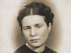 an old black and white photo of a woman