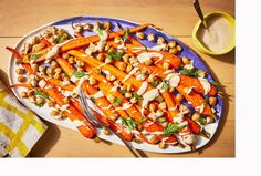 a plate with carrots and chickpeas on it