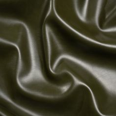 a close up view of a green leather textured material that looks like it has been dyed