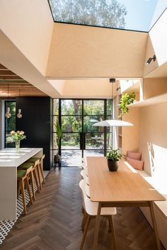 the dining room is very large and has an open floor plan with skylights above it