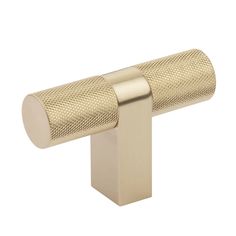 a gold metal handle on a white background