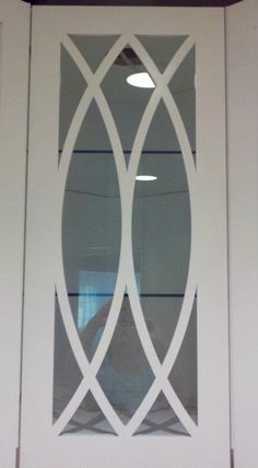 a white door with an intricate glass design