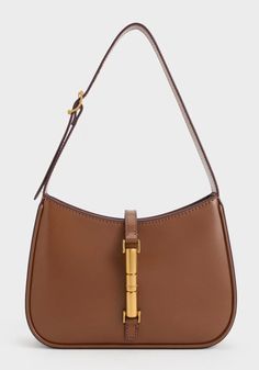 Brown shoulder bag with gold accents Brown Shoulder Bag, Brown Bag, Charles Keith, Brown Bags, Gold Accent, Metallic Accents, Everyday Wardrobe, Safety And Security, Kids Gifts