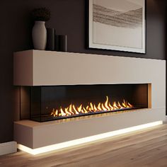 a modern fireplace in a living room with wood flooring