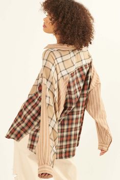 Plaid shirt. Colorblock design in contrasting plaids and stripes. Collared neckline. Button front closure. Long sleeves with buttoned cuffs. Yoke back. Side-split shirttail hem. Loose, oversized fit. 100% Cotton. Imported. Designed in LA. Model wears size S. Boho Shirts, Side Split, Diy Fashion, Plaid Shirt, Oversized Fits, Black Shirt, Color Blocking, Button Up Shirts, Split