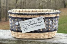 a wicker basket with a sign that says dreaming of white christmas