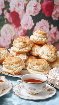 biscuits and tea on plates with pink flowers in the background