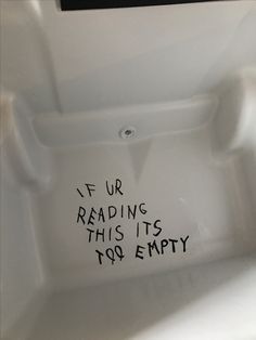 a white toilet with writing on the lid that says if ur reading this it's too empty