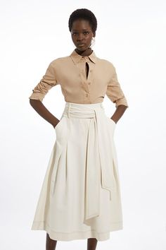 Feel Confident In Our Midi Skirt, Featuring A High, Belted Waistline That Cinches The Silhouette, A Formal, Flowing Silhouette, And A Classic, Pleated Design. Style It With A Blouse And Court Heels Or Ankle Boots For A Look Perfect For Office Days, Then Wear It With Heeled Boots Or Stilettos For An Evening Look. Tailored Full Skirted Belted Midaxi Skirt Flattering Flared Silhouette Comfortable High Waistline Statement Belted Waist Classic Pleat Features Zip Fastening On Hip Midi Skirt Suit, Formal Skirt Outfit Classy, Formal Skirt Outfit, A Line Skirt Outfits, Petite Wedding Guest Dresses, Panelled Skirt, Plus Size Workwear, Midaxi Skirt, Chic Outfits Classy