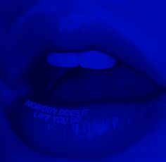 a close up view of a blue lip with the words nobody does it make you do