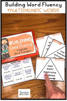 the building word fluency game is shown with four cards and one hand pointing at it