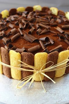 a cake with chocolate frosting and yellow icing