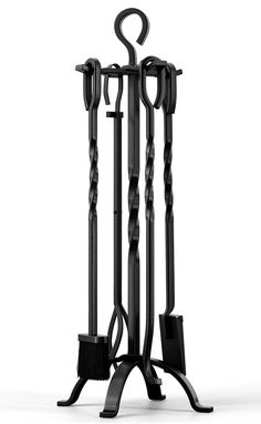 a black metal stand with two brooms on it