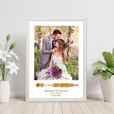 a wedding photo frame with the words, stairway to heaven and flowers in front of it