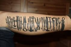 a man's arm with writing on it and scissors in black ink that reads,