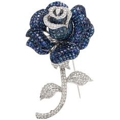 The pin is finly crfted in 18k ehite gold with diamonds weighing approximately total of 4.30 carat and sapphire weighing approximately 70.14 carat. Beautiful and unique pin. Luxury Brooches With Rose Cut Diamonds, Luxury Flower Shaped Brooch Jewelry, Luxury Sapphire Brooches As Gifts, Luxury Sapphire Brooches For Gift, Luxury Sapphire Brooches Gift, Luxury Sapphire Brooches As A Gift, Luxury Sapphire Brooch Jewelry, Luxury Sapphire Brooches For Formal Occasions, Luxury Sapphire Brooches For Formal Events