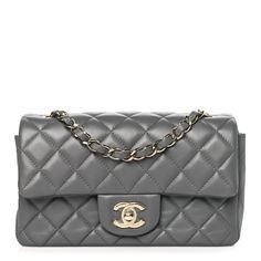 This is an authentic CHANEL Lambskin Quilted Mini Rectangular Flap in Dark Grey. The chic mini crossbody classic is crafted in soft quilted lambskin leather in grey. The bag features a polished light gold chain link leather threaded shoulder strap and a polished light gold classic CC turn lock. This opens the flap to a grey leather interior with pockets. Leather Thread, Mini Crossbody, Grey Leather, The Chic, Leather Interior, Lambskin Leather, Chain Link, Gold Chain, Gold Chains