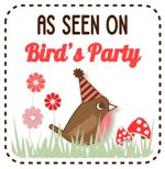 a bird's party sign with mushrooms and flowers in the background, says as seen on bird's party