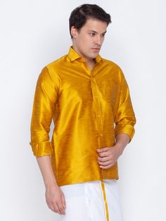 VM By VASTRAMAY Men's Mustard Silk Blend Ethnic Shirt Embrace effortless style and comfort with the VM By VASTRAMAY Men's Mustard Silk Blend Ethnic Shirt. This shirt is crafted from a luxurious silk blend fabric that drapes elegantly and feels soft against the skin. Key Features: Mustard yellow, solid color Classic shirt collar for a polished look Short sleeves for added breathability Straight hem for a clean silhouette One patch pocket for a touch of functionality Specifications: Sleeve Length: Classic Long Sleeve Festive Traditional Wear, Traditional Long Sleeve Shirt For Festive Occasions, Festive Semi-formal Long Sleeve Shirt, Traditional Long Sleeve Shirt For Eid, Casual Festive Traditional Wear With Long Sleeves, Traditional Long Sleeve Festive Shirt, Casual Long Sleeve Festive Traditional Wear, Casual Festive Long Sleeve Traditional Wear, Festive Casual Long Sleeve Shirt