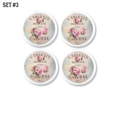 four coasters with pink roses on them sitting in front of a white background, set 3