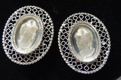 Reverse intaglio Lucite Whiting and Davis Cameo clip earrings. The earrings are oval shaped and measure 1 inch high by 7/8 inch wide and marked Whiting and Davis.  Each is surrounded by silver tone filagree design.  Excellent condition.  Please write me if you have questions.  Wonderful Christmas gift!  I'll be most happy to gift wrap and mail to any USA address for a total shipping fee of 3.50. Reverse Intaglio, Filagree Design, Clip Earrings, Colorado Springs, Gift Wrap, Clip On Earrings, 1 Inch, Springs, Etsy Earrings