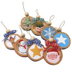 wooden christmas ornaments with santa and snowmen on them, hanging from strings in front of a white background