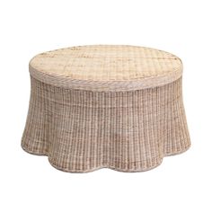 a round wicker table with a white background