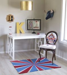 a white desk with a chair next to it