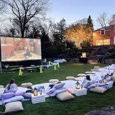 an outdoor movie is set up on the lawn