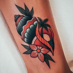 a woman's leg with an orange ribbon and flowers tattoo on her left thigh