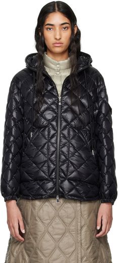 DIST-certified down-filled quilted nylon satin jacket. · Drawstring at hood · Stand collar · Two-way zip closure · Press-stud welt pockets · Curved hem · Flap pocket and felted logo patch at sleeve · Elasticized cuffs · Fully lined Supplier color: Black Fill: 90% goose down, 10% feather. Luxury Hooded Duck Down Puffer Jacket, Quilted Hooded Duck Down Puffer Jacket, Quilted Duck Down Hooded Puffer Jacket, Hooded Quilted Down Jacket With Zipper Closure, Hooded Down Quilted Jacket With Zipper Closure, Luxury Hooded Puffer Jacket With Zipper Closure, Luxury Quilted Hooded Puffer Jacket, Luxury Quilted Hooded Outerwear, Moncler Women