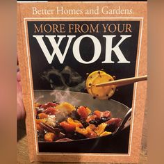 a cookbook with the title'better homes and gardens more from your wok '