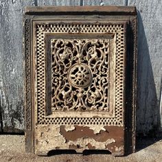 Antique Architectural Salvage Victorian Arts and Crafts Cast Iron Filigree Grill Fireplace Summer Cover. Circa late 1800s. It is in good condition with mild to moderate surface oxidation, surface wear appropriate to age, chippy white paint, and has a small portion of damage to the center knot emblem, as well as a sheet metal back which is somewhat damaged and bent and being held on currently by a sing piece of bailing wire (see photos for details). Measurements as follows: Height: 26 1/2 inches  Width: 20 1/2 inches Grill Fireplace, Antique Architectural Salvage, Fireplace Screens, Victorian Art, White Paint, Architectural Salvage, Sheet Metal, White Paints, See Photo