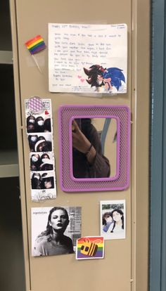 a refrigerator with pictures and magnets on the door, in a school classroom setting