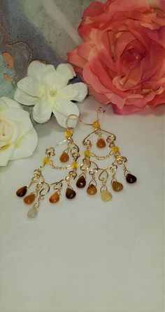 Beautiful Carnelian and 14K Gold Filled Teardrop Gemstone Chandelier Earrings. They are elegant and dangly with a Bohemian twist. Handmade of high quality 14 karat gold filled wire, 14 karat gold filled chain with carnelian teardrop gemstones. These earrings have classic lines and are perfect for day wear or a special evening out. These Carnelian Gemstones (approx stone size is 9.95mm x 6.64 mm )are in complementary shades of cream and peaches on 14K Gold Filled wire. Uniquely created, Handmade Gemstone Chandelier, Chip Jewelry, Bohemian Twist, Evening Earrings, Gold Chandelier Earrings, Sterling Silver Cross Necklace, Sterling Silver Cross Pendant, Gold Dangle Earrings, Earrings Bohemian