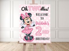 a pink minnie mouse birthday sign with polka dots and the words,'oh twodles welcome to deltaria's 2nd birthday '