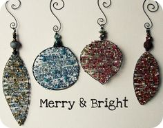 three christmas ornament hanging from hooks with merry and bright written on the front