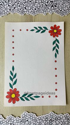 a white paper with red flowers and green leaves on the border is surrounded by lacy doily