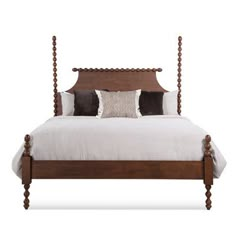 a bed with four posts and pillows on it's headboard, against a white background